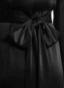 Black modest velvet elegance abaya dress featuring dramatic wide sleeves, mock neck, and tie-back bow for sophisticated evening wear - styling view