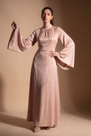 Wide bell sleeve of the Camille beige velvet evening dress, editorial pose