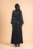 Camille long black velvet dress, full length back view on model