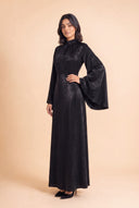 Mystic Modesty Camille black modest evening dress with wide bell sleeves – three-quarter front angle