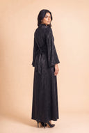 Camille black modest velvet dress, three quarter back view, floor length cut