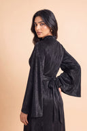 Over the shoulder portrait in the Camille black hijab friendly evening dress