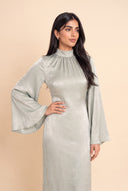 Editorial portrait in the Camille sage green velvet evening dress with sleeves