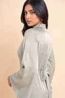 Over the shoulder portrait in the Camille sage green hijab friendly dress