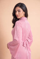 Over the shoulder portrait in the Camille pink hijab friendly velvet dress