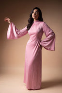 Wide bell sleeve of the Camille pink velvet evening dress, editorial pose