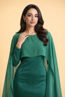 Chiffon Dream Modest Evening Dress in Emerald Green — close-up of bodice, neckline, and upper styling detail — modeled without hijab — modest evening fashion for all — Mystic Modesty premium modest dress UK.