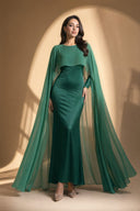 Chiffon Dream Modest Evening Dress in Emerald Green — editorial campaign power pose, cinematic hero shot — modeled without hijab — modest evening fashion for all — Mystic Modesty modest fashion UK.