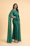 Chiffon Dream Modest Evening Dress in Emerald Green — three-quarter front angle showing dimensional drape and silhouette — modeled without hijab — modest evening fashion for all — Mystic Modesty modest evening gown collection.