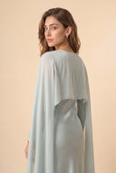 Mystic Modesty Chiffon Dream mint green modest evening dress, over-shoulder back portrait, draped chiffon cape detail