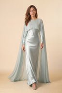 Mystic Modesty Chiffon Dream mint green modest evening gown, walking shot, floor-length satin with sheer chiffon cape