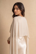 Mystic Modesty Chiffon Dream soft beige modest evening dress, over-shoulder back portrait, draped chiffon cape detail
