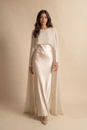 Mystic Modesty Chiffon Dream soft beige modest evening gown, walking shot, floor-length satin with sheer chiffon cape