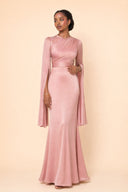 Modest Luxe Satin Evening Gown in Blush Pink — editorial quiet moment, contemplative pose — modeled without hijab — modest evening fashion for all — Mystic Modesty modest evening dress.