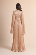 Modest Pleated Satin Gown in Champagne Cream — full-body back view of the dress — modeled without hijab — modest evening fashion for all — Mystic Modesty hijab fashion modest gown.