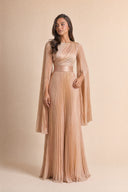 Modest Pleated Satin Gown in Champagne Cream — editorial quiet moment, contemplative pose — modeled without hijab — modest evening fashion for all — Mystic Modesty modest evening dress.