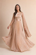 Modest Pleated Satin Gown in Champagne Cream — captured in natural stride showing fabric flow and movement — modeled without hijab — modest evening fashion for all — Mystic Modesty modest evening fashion.