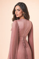 Modest Pleated Satin Gown in Dusty Rose — over-shoulder back profile portrait, intimate editorial close-up — modeled without hijab — modest evening fashion for all — Mystic Modesty premium hijab fashion brand.