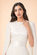 Modest Pleated Satin Gown in Ivory White — close-up of bodice, neckline, and upper styling detail — modeled without hijab — modest evening fashion for all — Mystic Modesty premium modest dress UK.