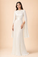 Modest Pleated Satin Gown in Ivory White — full-body front view of the dress — modeled without hijab — modest evening fashion for all — Mystic Modesty modest occasion wear.