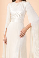 Modest Pleated Satin Gown in Ivory White — mid-body view showing waist construction and elegant jewelry detail — modeled without hijab — modest evening fashion for all — Mystic Modesty modest occasion gown.