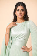 Modest Pleated Satin Gown in Mint Green — close-up of bodice, neckline, and upper styling detail — modeled without hijab — modest evening fashion for all — Mystic Modesty premium modest dress UK.
