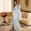 Mystic Modesty SS26— Mariya Aquatic Blue smooth satin, real-life Eid morning living room with kahwa and dates on gilded tray, modest evening wear, Vogue editorial film aesthetic