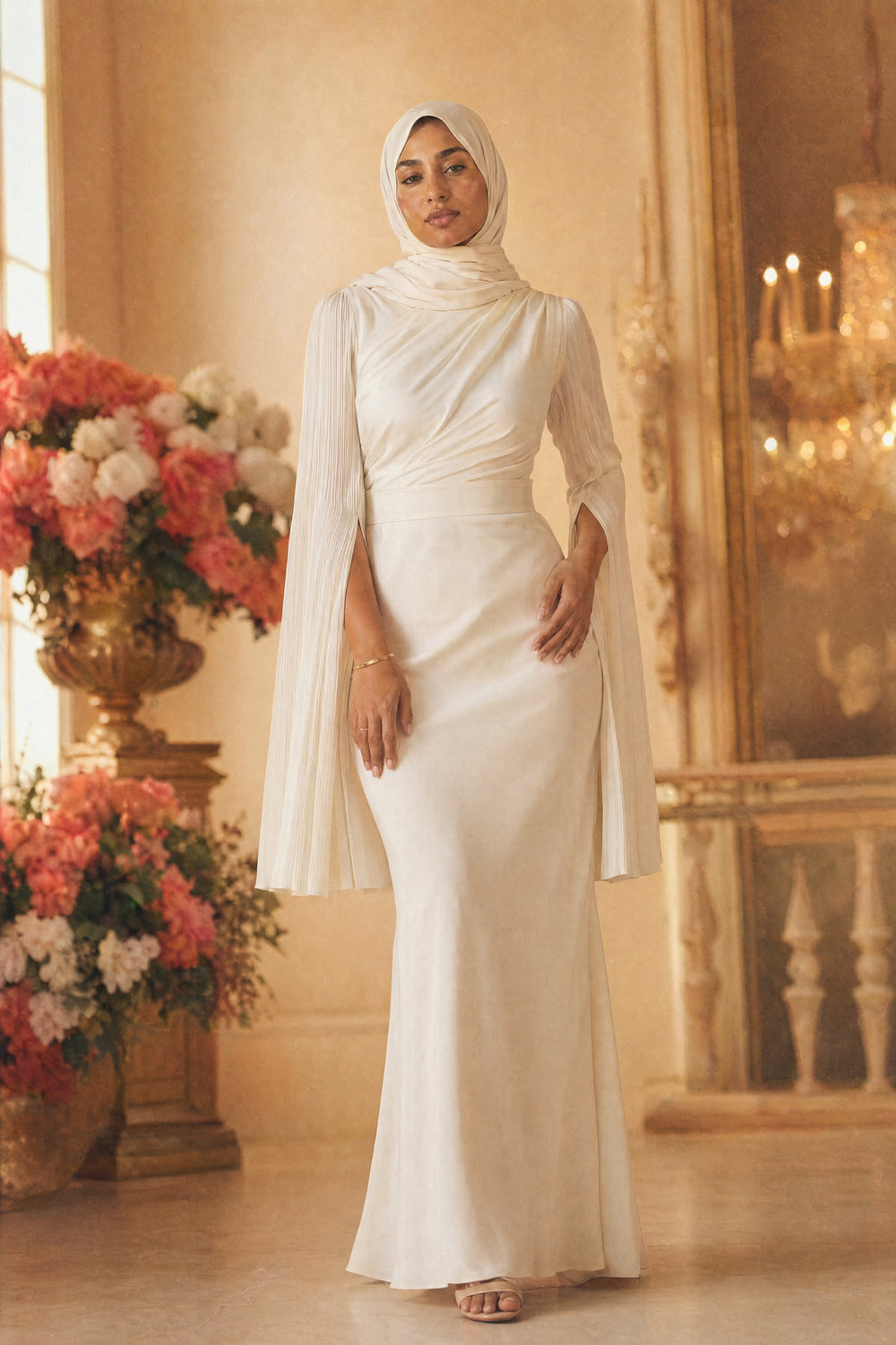 Mystic Modesty SS26— Mariya Ivory smooth satin, studio portrait against cream backdrop with coral peonies, modest evening wear, Vogue editorial film aesthetic