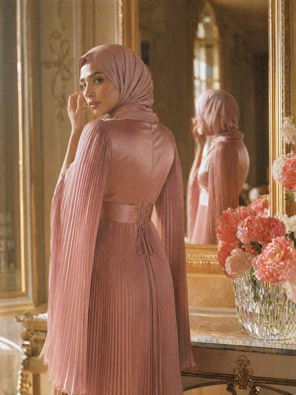 Mystic Modesty SS26— Saffira Rose pleated satin, intimate dressing-room moment with gilded mirror reflection, modest evening wear, Vogue editorial film aesthetic