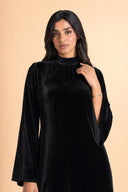 Velvet Elegance Modest Abaya Dress in Deep Black — close-up of bodice, neckline, and upper styling detail — modeled without hijab — modest evening fashion for all — Mystic Modesty premium modest dress UK.