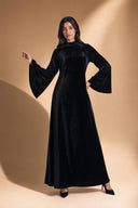 Velvet Elegance Modest Abaya Dress in Deep Black — editorial campaign power pose, cinematic hero shot — modeled without hijab — modest evening fashion for all — Mystic Modesty modest fashion UK.