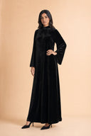 Velvet Elegance Modest Abaya Dress in Deep Black — three-quarter front angle showing dimensional drape and silhouette — modeled without hijab — modest evening fashion for all — Mystic Modesty modest evening gown collection.