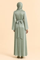 Velvet Elegance Modest Abaya Dress in Forest Green — full-body back view of the dress — modeled with hijab — Islamic modest styling — Mystic Modesty modest occasion wear.