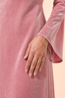 Velvet Elegance Modest Abaya Dress in Rose Pink — ultra-macro detail of premium fabric texture, sheen, and refined jewelry — modeled without hijab — modest evening fashion for all — Mystic Modesty premium modest evening wear.
