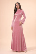 Velvet Elegance Modest Abaya Dress in Rose Pink — three-quarter front angle showing dimensional drape and silhouette — modeled without hijab — modest evening fashion for all — Mystic Modesty modest evening gown collection.