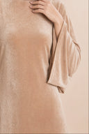 Velvet Elegance Modest Abaya Dress in Warm Beige — close-up of bodice, neckline, and upper styling detail — modeled with hijab — Islamic modest styling — Mystic Modesty modest formal wear for women.