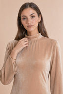 Velvet Elegance Modest Abaya Dress in Warm Beige — close-up of bodice, neckline, and upper styling detail — modeled without hijab — modest evening fashion for all — Mystic Modesty premium modest dress UK.