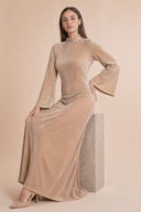 Velvet Elegance Modest Abaya Dress in Warm Beige — editorial campaign power pose, cinematic hero shot — modeled without hijab — modest evening fashion for all — Mystic Modesty modest fashion UK.