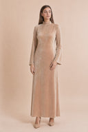 Velvet Elegance Modest Abaya Dress in Warm Beige — editorial quiet moment, contemplative pose — modeled without hijab — modest evening fashion for all — Mystic Modesty modest evening dress.